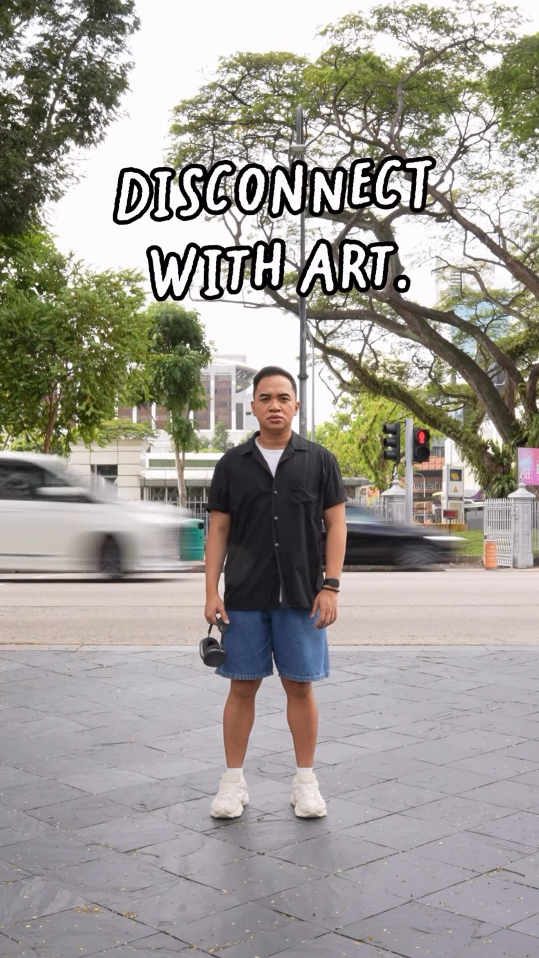 A man strolls around the Civic District calmly, appreciating art, while listening to “Procession. Possession”, a self-guided audio trail.