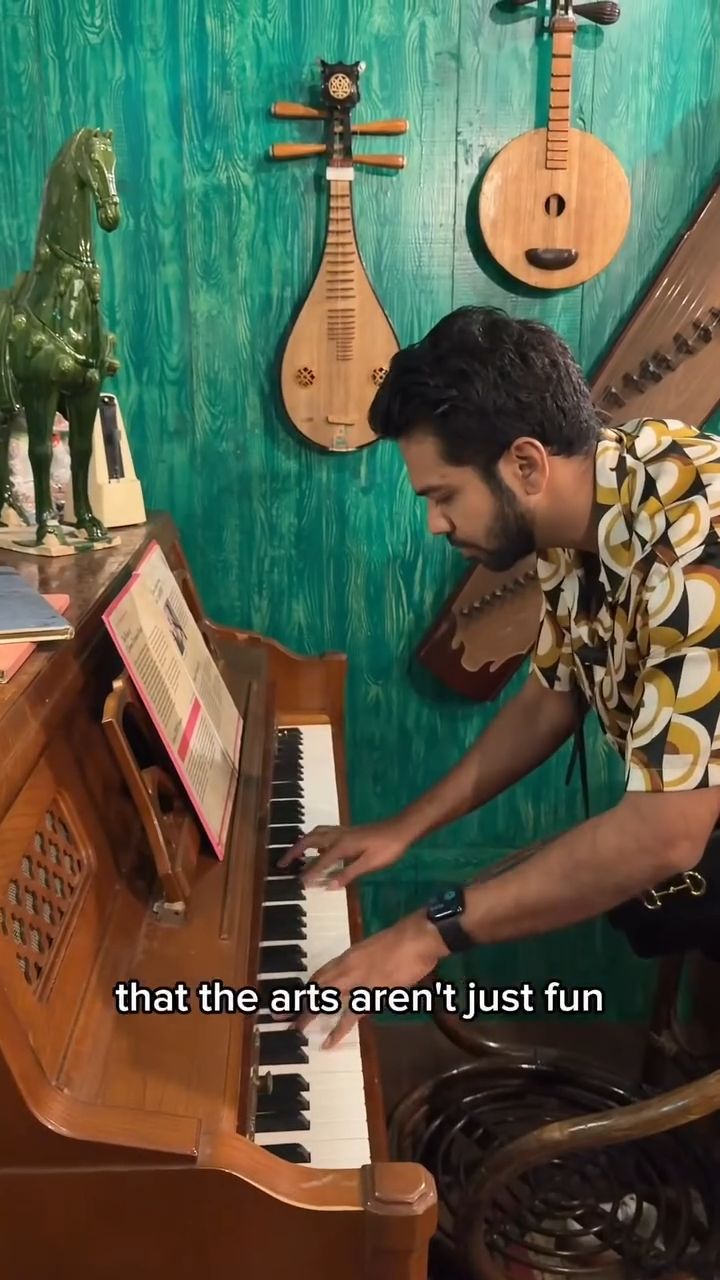 A man enjoys his time at SOUNDCLASH, Singapore's first permanent immersive exhibition about the evolution of Chinese music in Singapore. He engages in different interactive activities such as playing the piano and recording his singing.