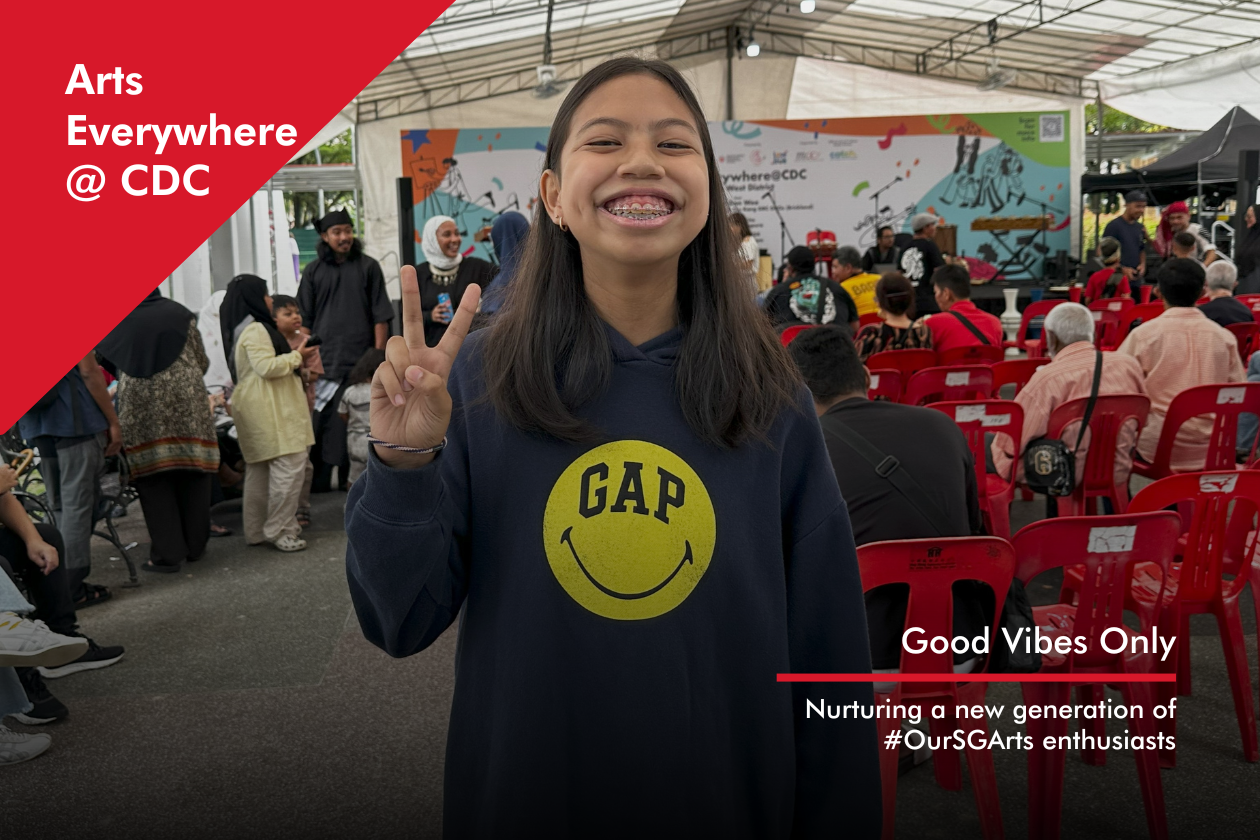 AECDC December Thumbnail A young girl smiling while posing a peace sign