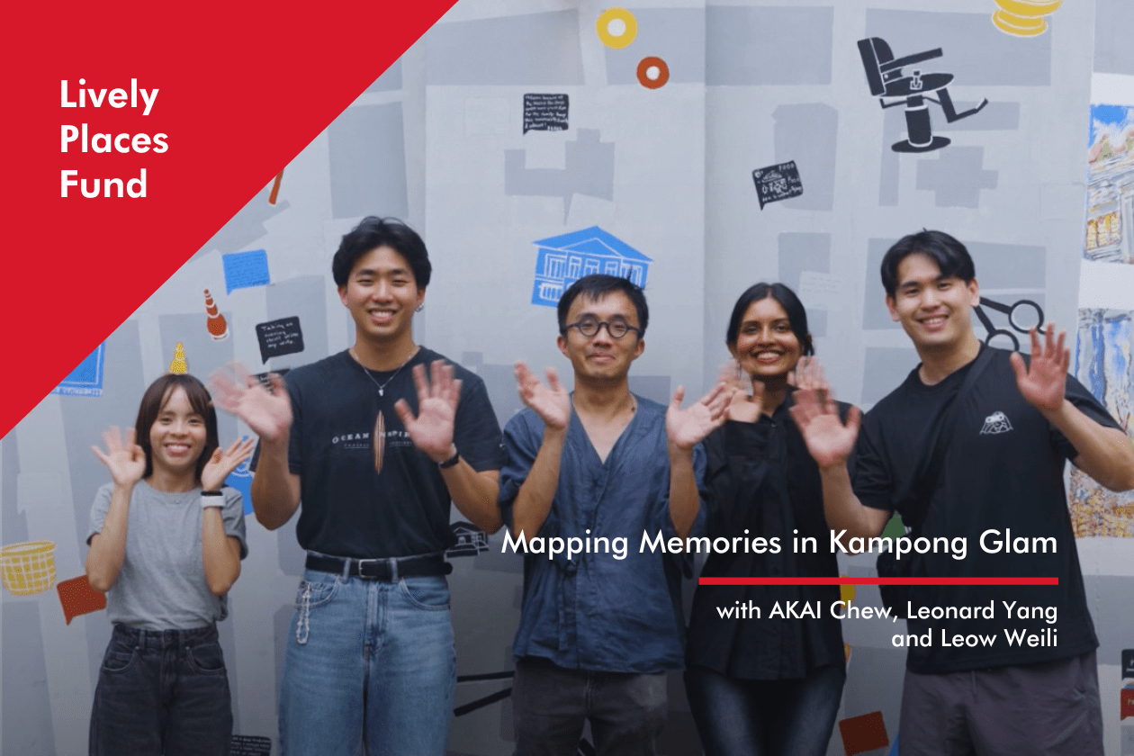 Artist Akai Chew accompanied by four other members of the community, stands in front of the mural and waves to the camera   A Particular Place: Mapping Memories in Kampong Glam