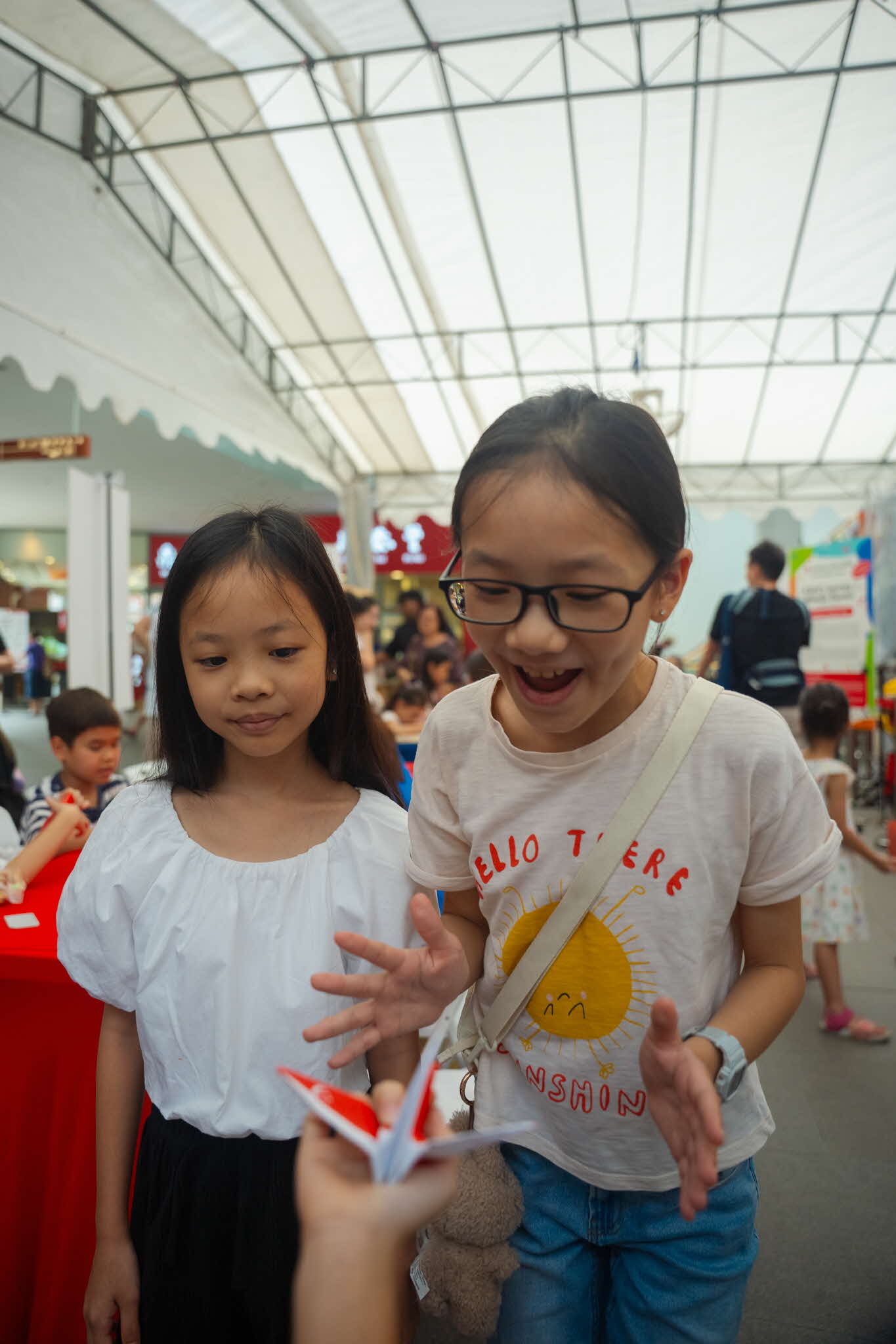 Two children excited over their crane origami creation at an ArtsEverywhere@CDC workshop. Discover Joy Together: ArtsEverywhere@CDC — Creating Family Memories through Art Two children excited over their crane origami creation at an ArtsEverywhere@CDC workshop. Discover Joy Together: ArtsEverywhere@CDC — Creating Family Memories through Art