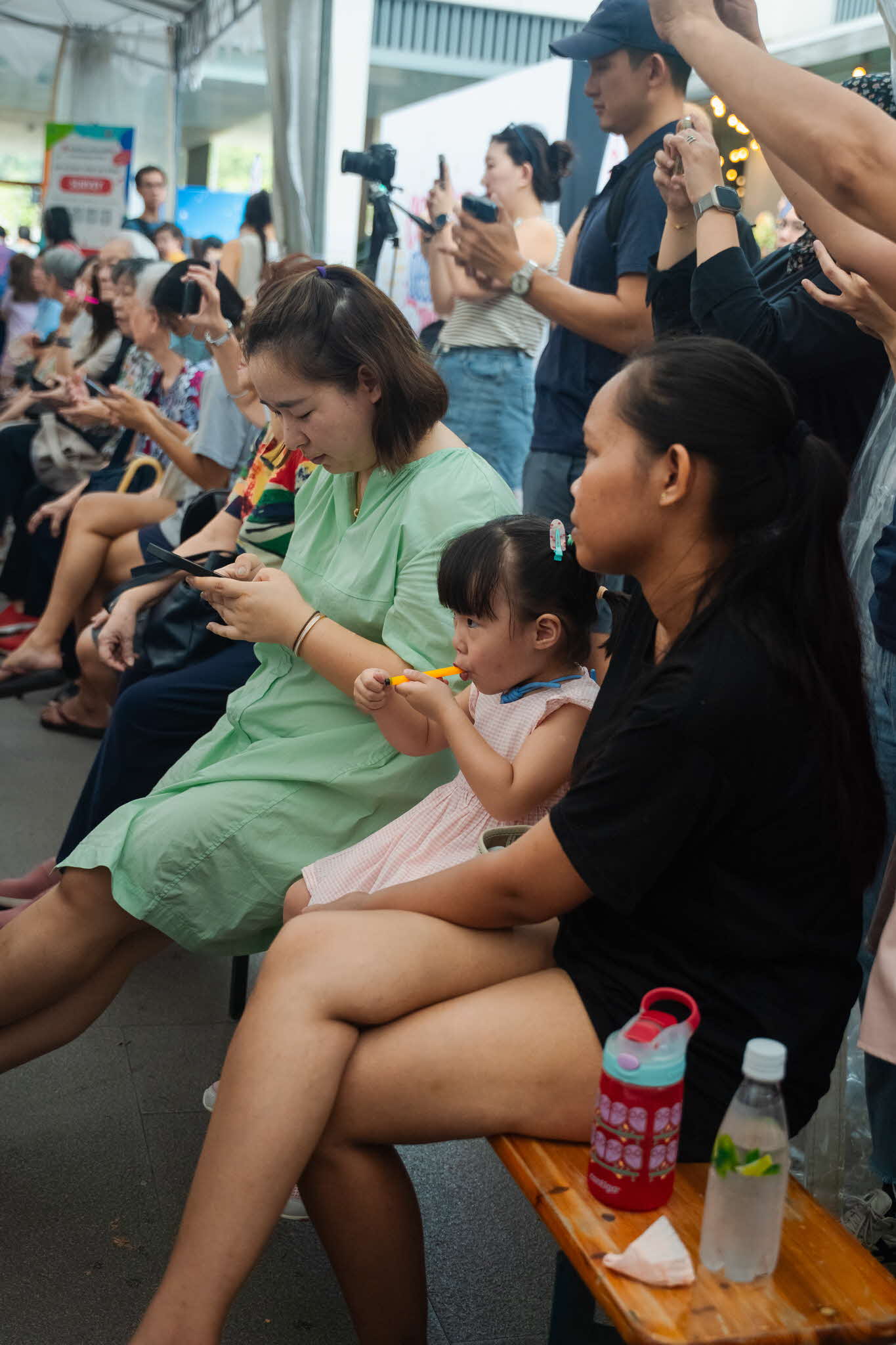 Audience members received bird flutes and learned to play them during yIN Harmony’s ArtsEverywhere@CDC performances. A young child seated and watching the yIN Harmony ArtsEverwhere@CDC performance while playing the bird flute. Discover Joy Together: ArtsEverywhere@CDC — Creating Family Memories through Art