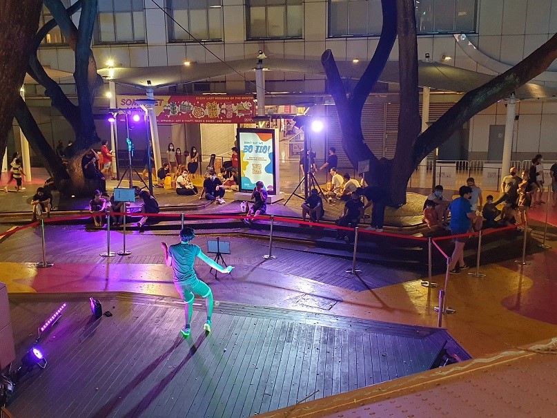 An act from the live busking pilots held in December 2020 at *SCAPE