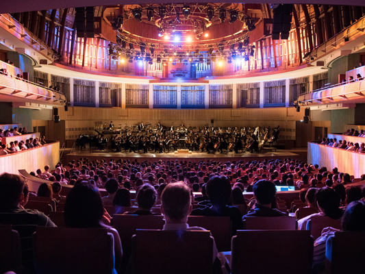 Photo of audience watching an orchestra. Photo Credit: Jack Yam and SSO